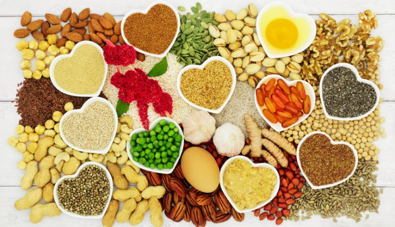 Protein-rich foods such as eggs and legumes in small heart-shaped ceramic bowls