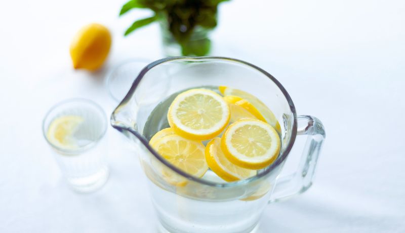 A glass of water with slices of lemon